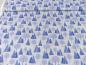 Preview: Patchworkstoff Tomtens Village Winterwald mit mit blauen Tannen